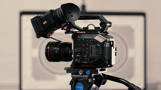 black professional video camera with tripods thumbnail