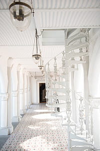 white spiral stairs near pillar thumbnail