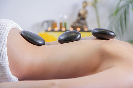three stones on person's back thumbnail