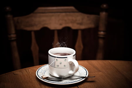 selective focus photo of white teacup with saucer on table thumbnail