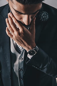 Man Looking Down In Suit Photo thumbnail