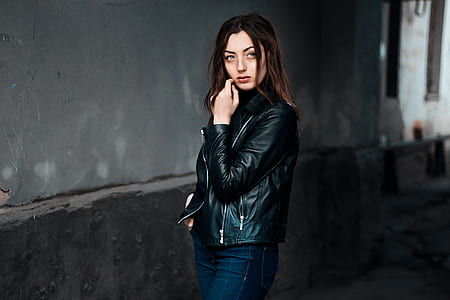 woman standing near wall thumbnail