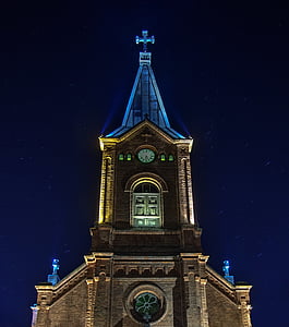 photograph of brown cathedral during night thumbnail
