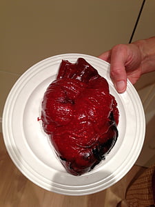 person holding plate with human heart thumbnail