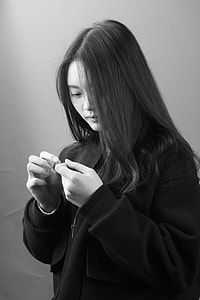 grayscale photo of woman in black zip-up jacket thumbnail