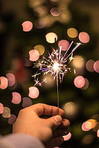 person holding fire cracker thumbnail