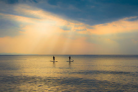 two person sailing on body of water during daytime thumbnail