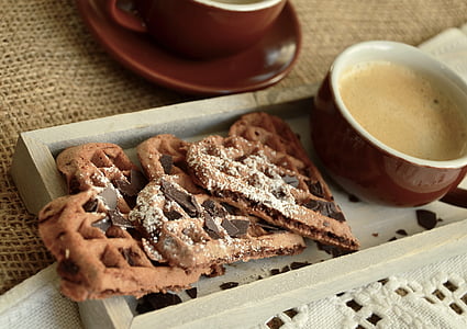 waffles in gray tray beside red teacup thumbnail