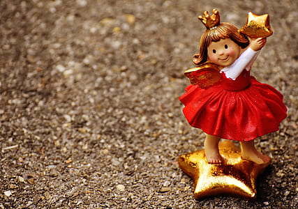 girl holding star figurine thumbnail