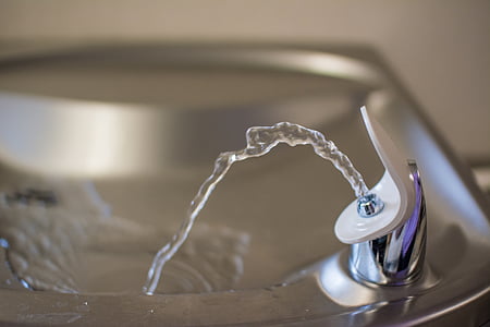 gray stainless steel sink with stainless steel faucet thumbnail