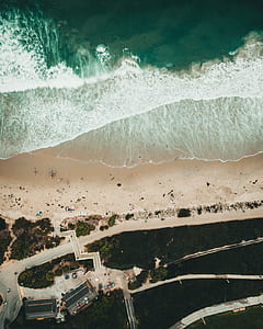 aerial view of beach during daytime thumbnail