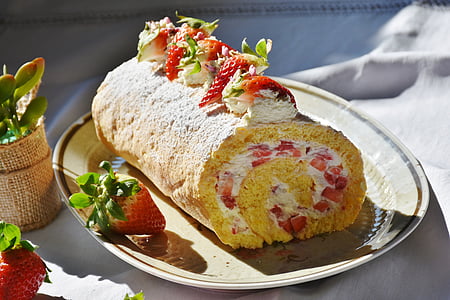 strawberry rolled cake on ceramic plate thumbnail
