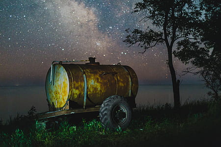 brown water tank near tree painting thumbnail