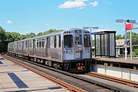 gray train on train rails thumbnail