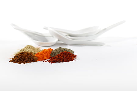 powders beside white spoons on white surface thumbnail