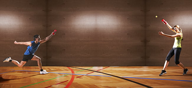 two people playing inside brown hall thumbnail