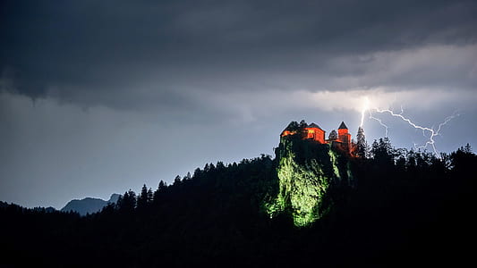 orange and gray castle on top on mountain thumbnail