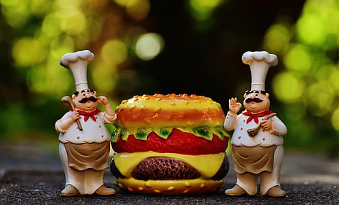 two Chefs standing near large burger miniatures thumbnail