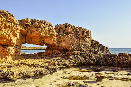 arch brown near seashore thumbnail