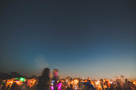 people standing under starry sky thumbnail