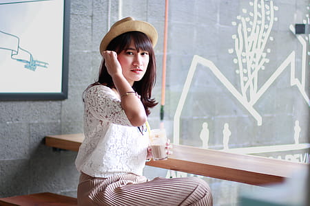 Photography of a Woman Sitting on Bench thumbnail