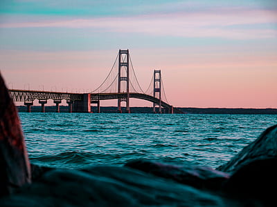 gray suspension bridge near body of water thumbnail
