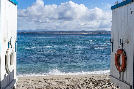 photo of white wooden gate beside sea thumbnail