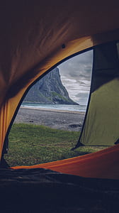orange and gray tent near body of water thumbnail