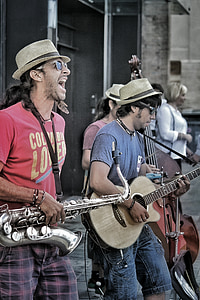 two men playing saxophone and guitar thumbnail