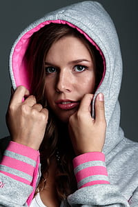 woman wearing pink and gray hooded jacket thumbnail
