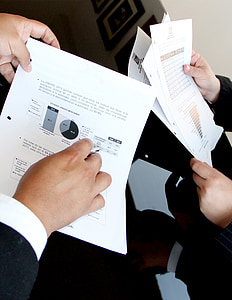 two person holding printer paper thumbnail