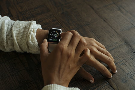 person adjusting smartwatch thumbnail