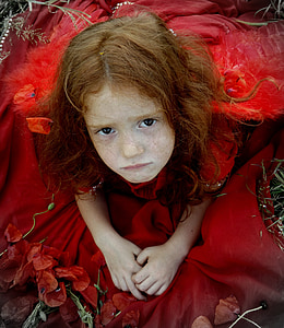 girl wearing red dress while sitting thumbnail