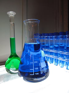 two green and blue liquid filled clear glass containers thumbnail