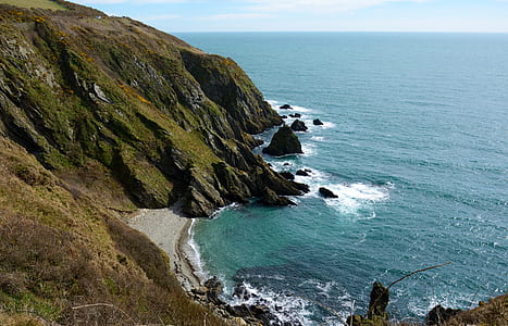 seashore beside mountain thumbnail