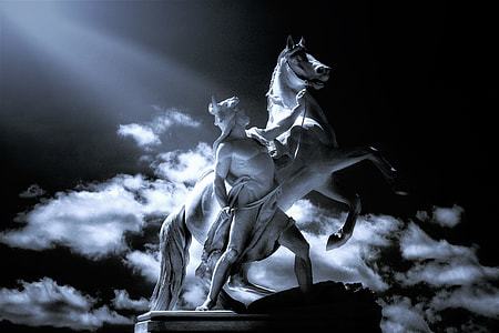 man holding rearing horse statue thumbnail