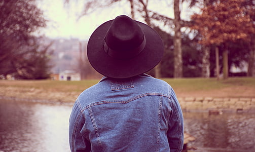 person wearing blue denim jacket and black hat thumbnail