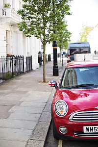 red Mini Cooper parked on gray top road during daytime thumbnail