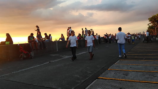 Group of People Walking on Pavement thumbnail
