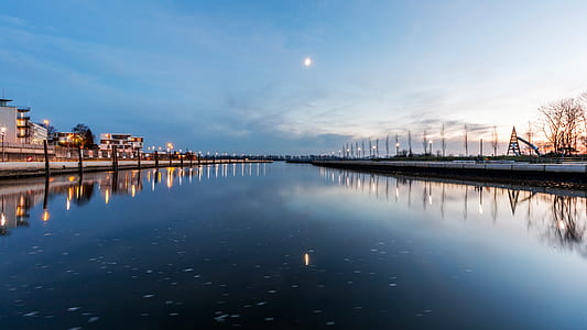 low angle photography of calm body of water thumbnail