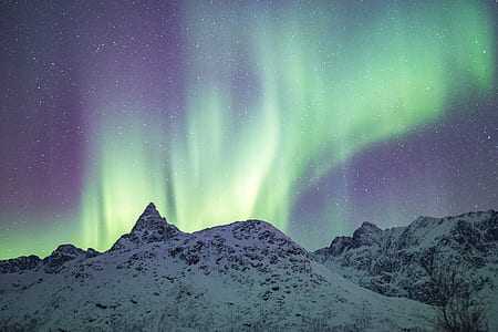 ice cupped mountain under starry night and green light fixture thumbnail