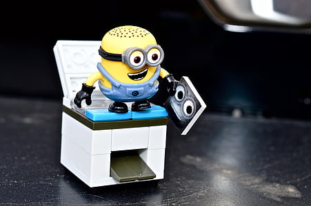 Bob the minion toy on gas range toy in close-up photography thumbnail