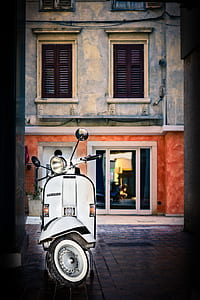 white motor scooter on street thumbnail
