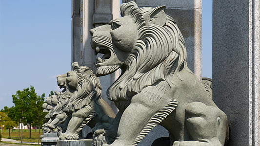 stone lion statues near wall thumbnail