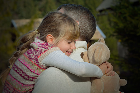 man and child hugging each other thumbnail