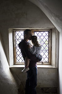 man holding her daughter during daytime thumbnail