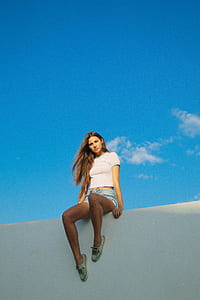 woman sitting on the wall thumbnail