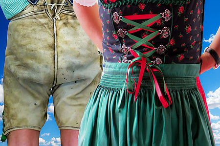person wearing green and multicolored lace-up dress thumbnail