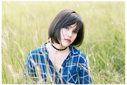 woman sitting on grass thumbnail