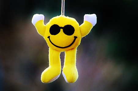 selective focus photography of hanging emoji plush toy thumbnail